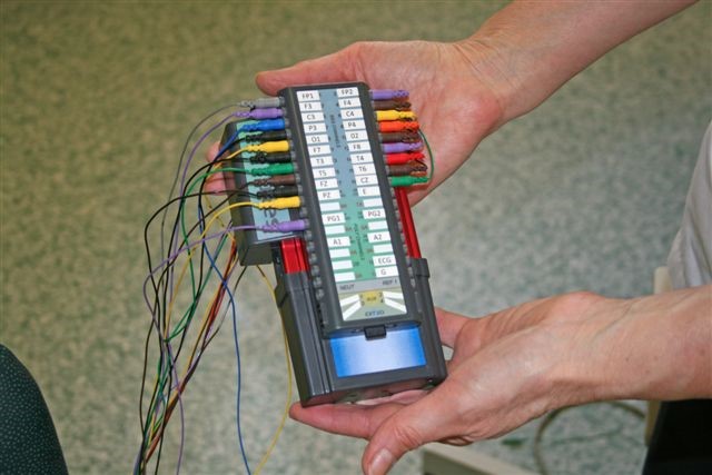 A medical device with lots of coloured wires.