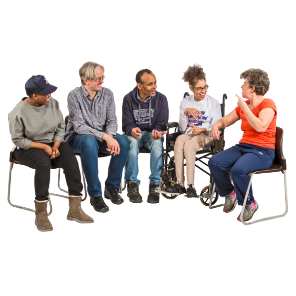A group of people sitting together and having a conversation.