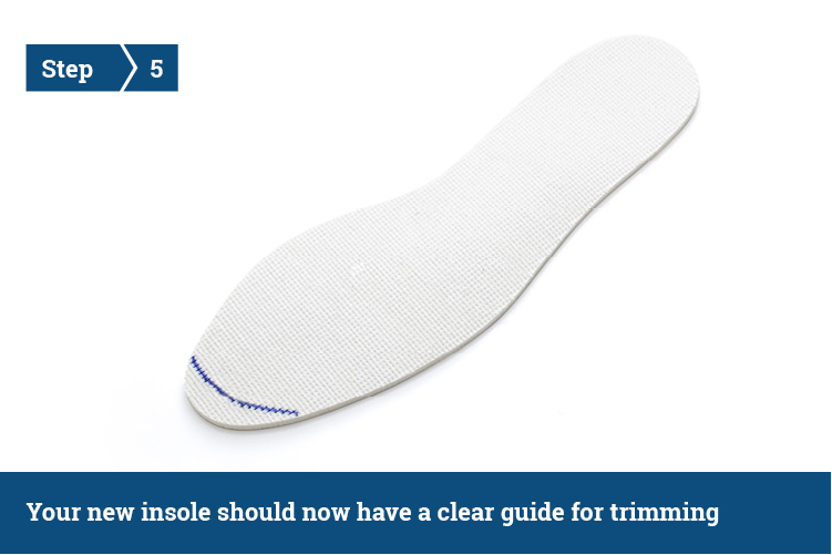 A shoe insole with a line drawn at the top, illustrating where to trim.