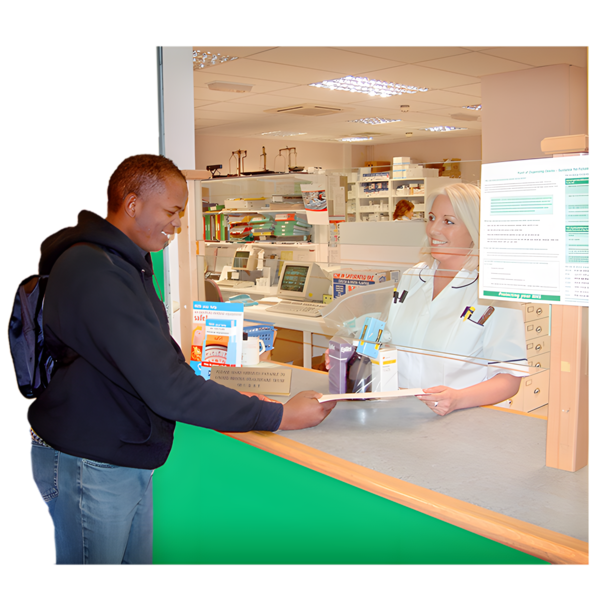 A person receiving a prescription from a pharmacist at a pharmacy counter. Both individuals are smiling, and the pharmacy is stocked with various medical supplies.