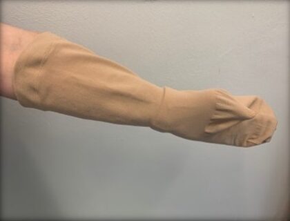 A person preparing to put on a compression garment.