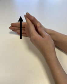 A pair of hands demonstrating thumb stretches.