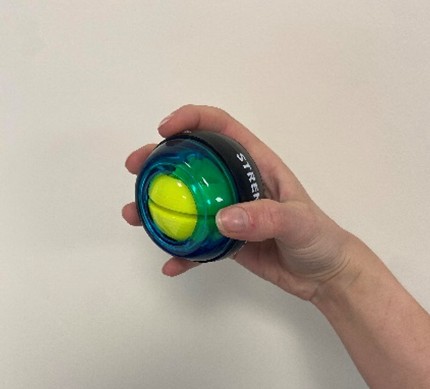 A person holding a yellow ball.